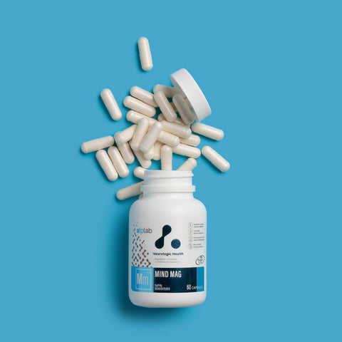 MIND MAG Supplement bottle by ATP Lab with scattered capsules on a blue background available at Healthsupp