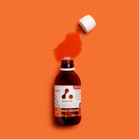 Bottle of Omega-3 triglyceride supplement raspberry lemonade flavor by ATP Lab on an orange background