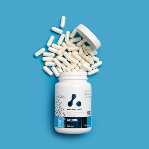 SynerMag Supplement bottle by ATP Lab with white capsules spilling out on a blue background available at Healthsupp