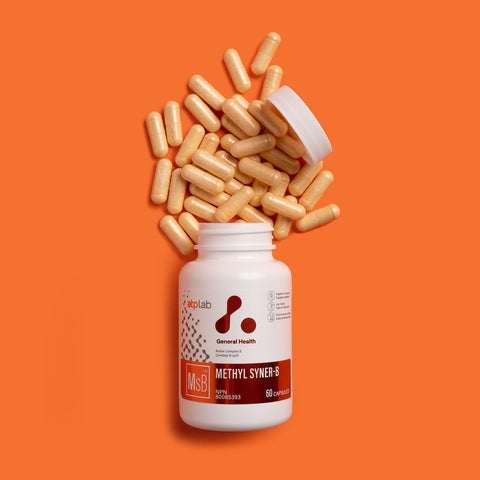 Methyl Syner-B supplement bottle with capsules on an orange background available at Healthsupp