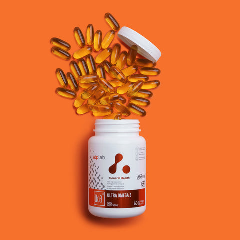 Ultra Omega 3 supplement bottle by ATP LAB with some softgel on an orange background available at Healthsupp
