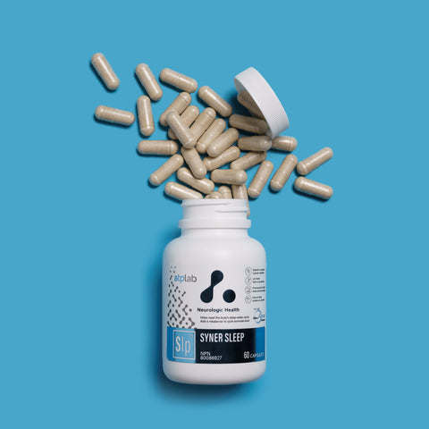 Syner Sleep supplement bottle by ATP Lab with scattered capsules on a blue background available at Healthsupp